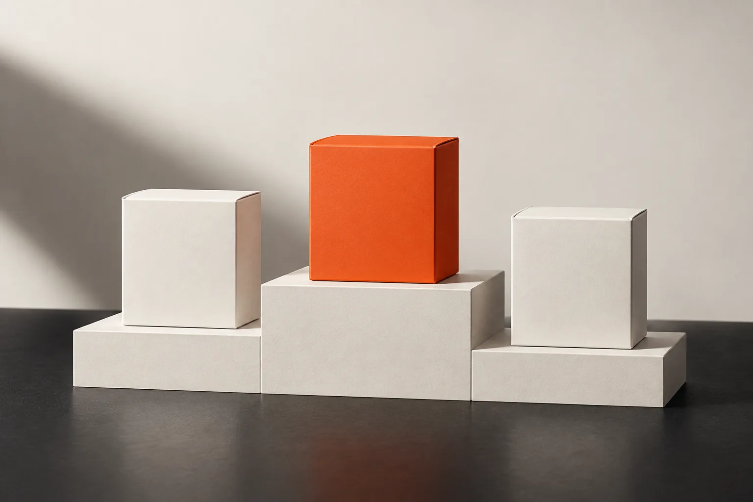 A white podium with an orange box on the highest step.