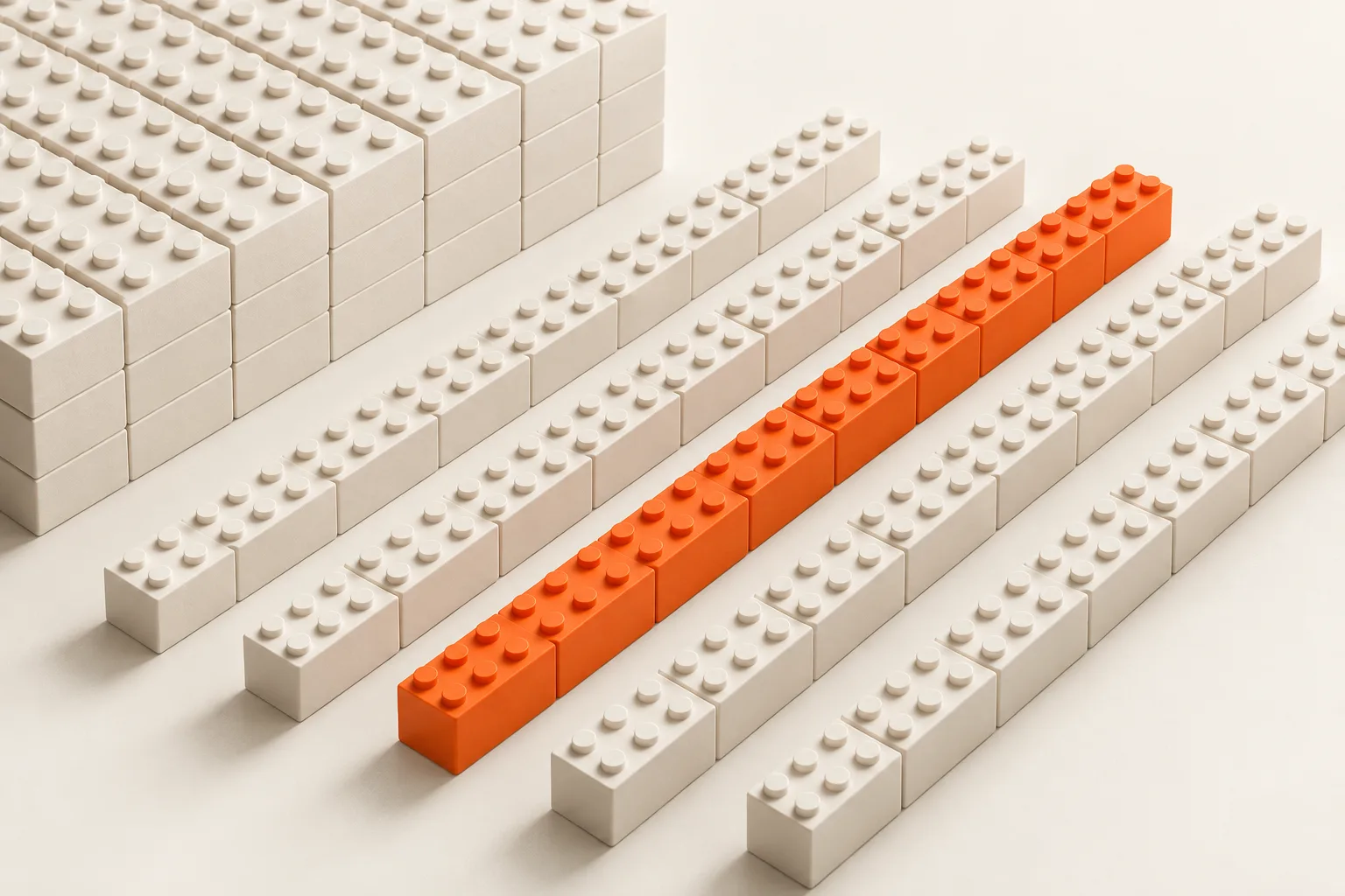Rows of white building bricks with one orange row.